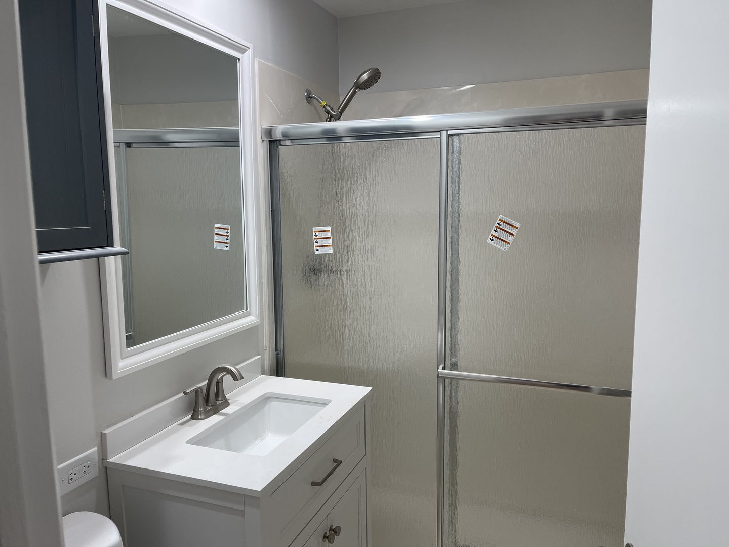 1720 South Cumberland Avenue Park Ridge, IL 60068 - Photo 15 of 26 a bathroom with a sink mirror and shower