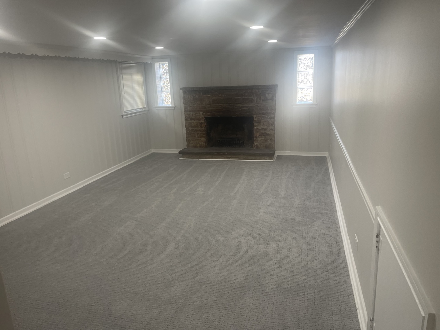 1720 South Cumberland Avenue Park Ridge, IL 60068 - Photo 24 of 26 an empty room with windows and fireplace