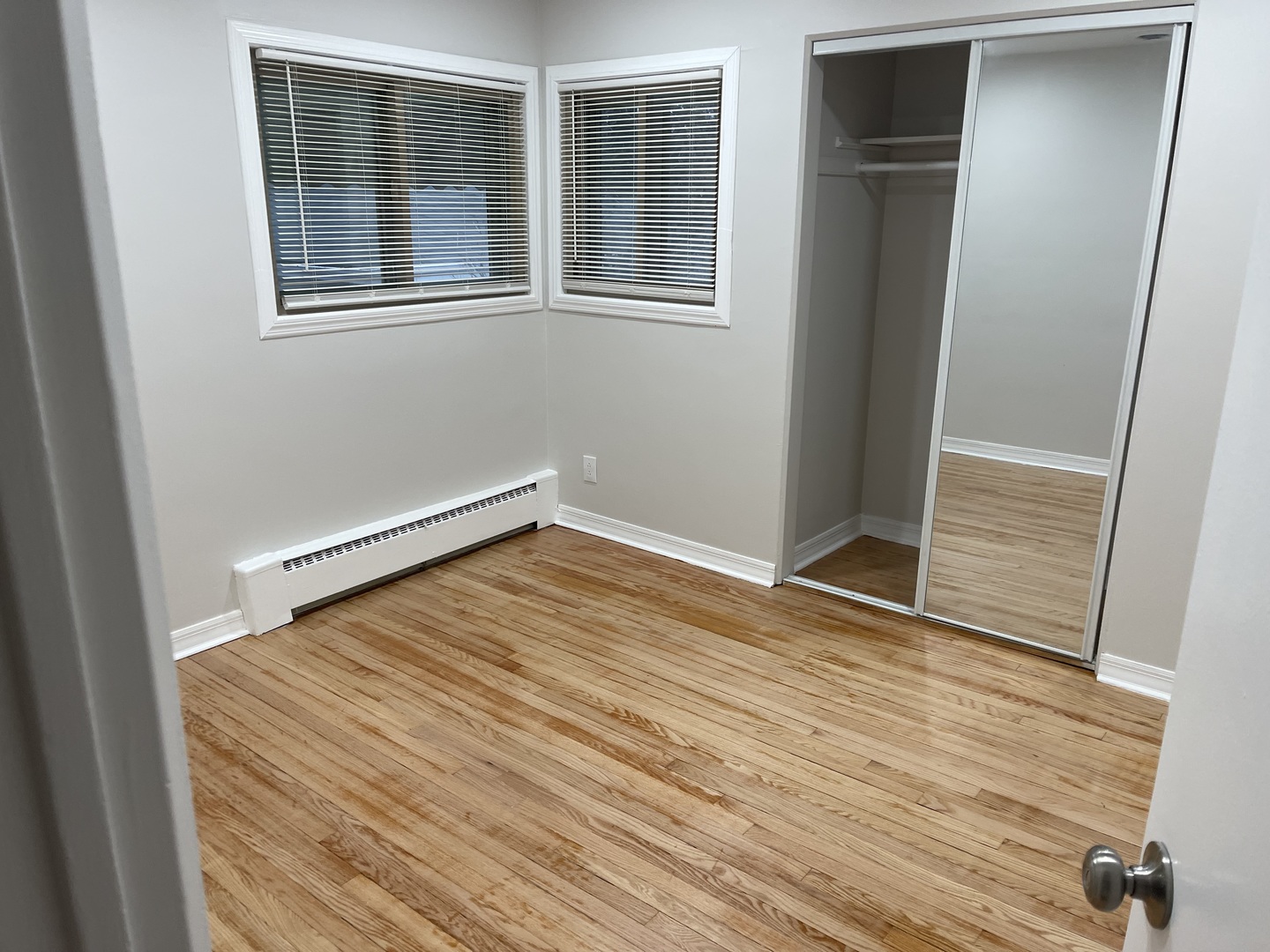 1720 South Cumberland Avenue Park Ridge, IL 60068 - Photo 7 of 26 an empty room with wooden floor and windows