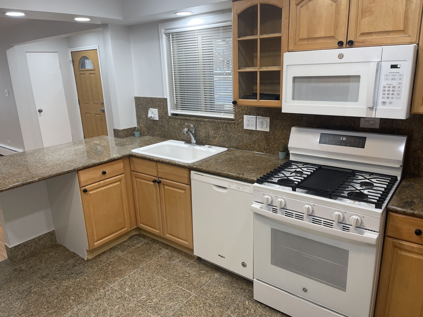 1720 South Cumberland Avenue Park Ridge, IL 60068 - Photo 8 of 26 a kitchen with a stove and a microwave