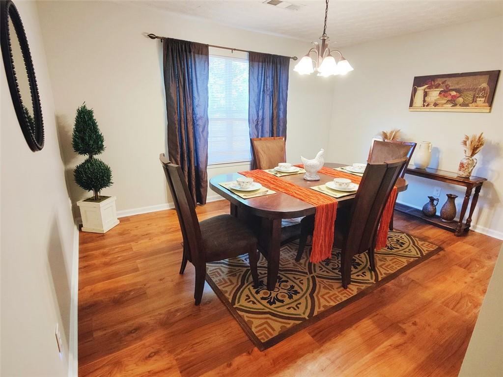 1600 Keystone Drive Conley, GA 30288 - Photo 5 of 14 a view of a dining room with furniture and wooden floor