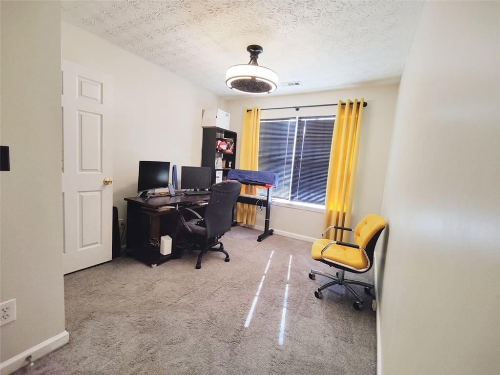 1600 Keystone Drive Conley, GA 30288 - Photo 9 of 14 a living room with furniture and a window