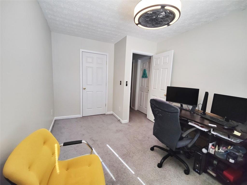 1600 Keystone Drive Conley, GA 30288 - Photo 10 of 14 a view of a workspace with a couch