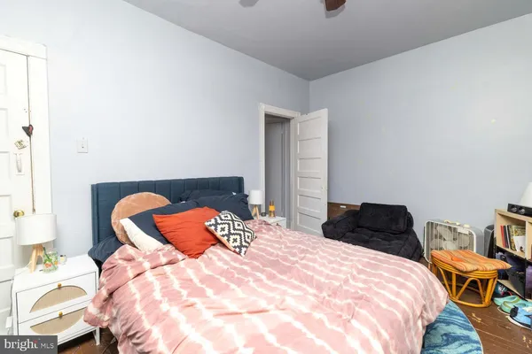 a bedroom with a bed and dresser