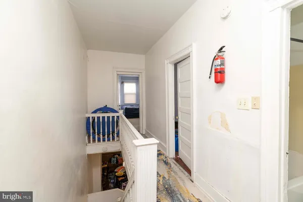 a view of living room with furniture and front door