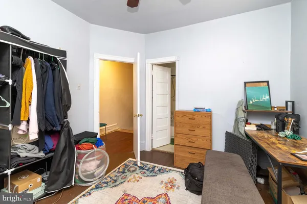 a bedroom with a bed and furniture