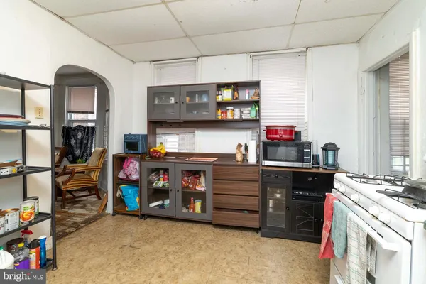 a kitchen with stainless steel appliances granite countertop a stove and cabinets