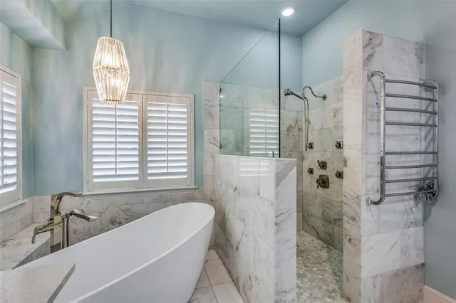 a bathroom with a granite countertop sink a toilet and shower
