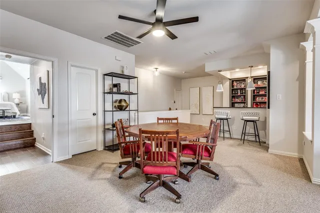 a view of a dining room with furniture and a rug
