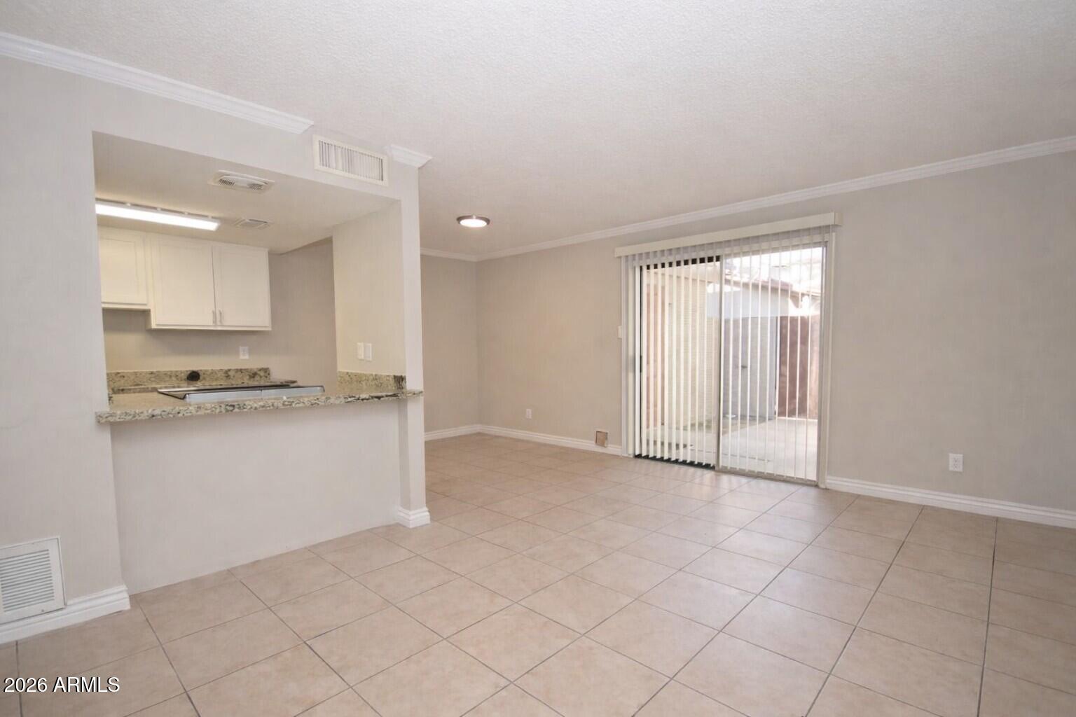 4043 West Wonderview Road Phoenix, AZ 85019 - Photo 3 of 10 a view of kitchen with granite countertop cabinets and white appliances