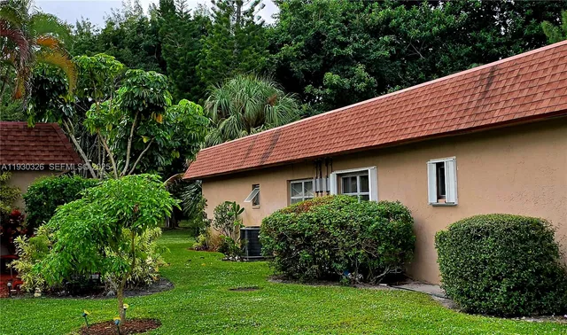 a view of a house with a garden