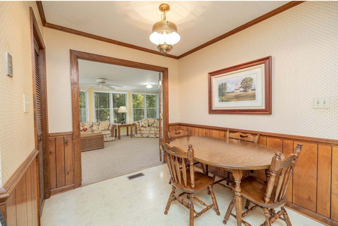 6509 Woodshire Place Raleigh, NC 27612 - Photo 14 of 30 a dining room with furniture and window