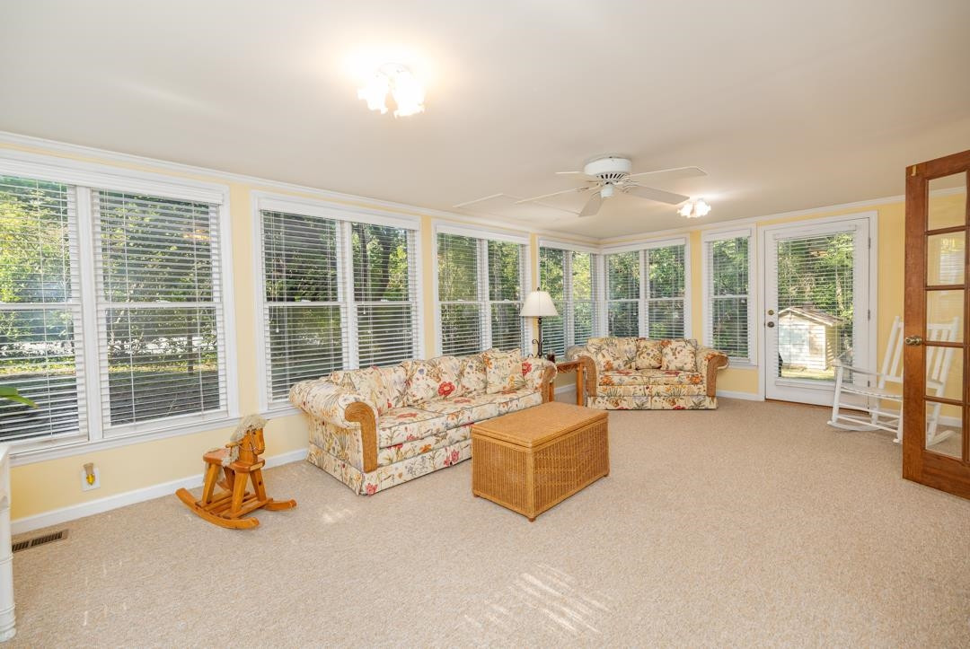 6509 Woodshire Place Raleigh, NC 27612 - Photo 18 of 30 a bedroom with furniture and large windows