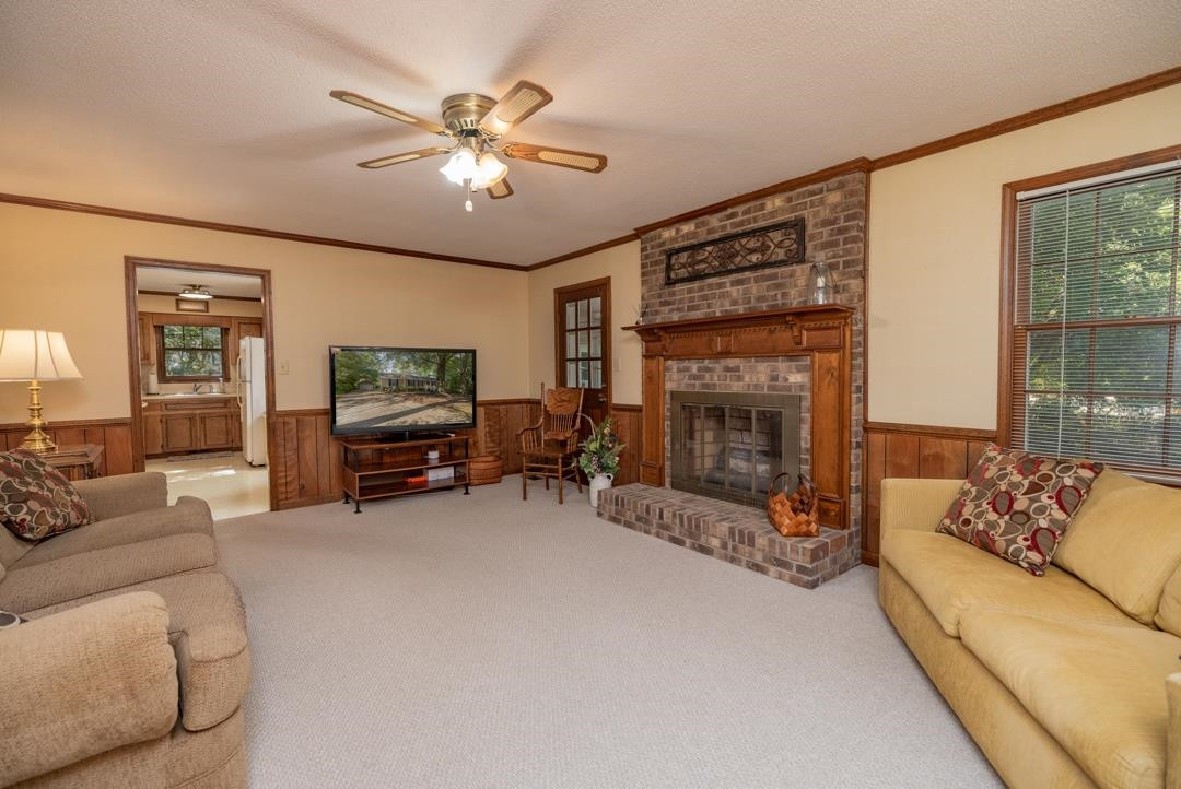 6509 Woodshire Place Raleigh, NC 27612 - Photo 21 of 30 a living room with furniture and a fireplace