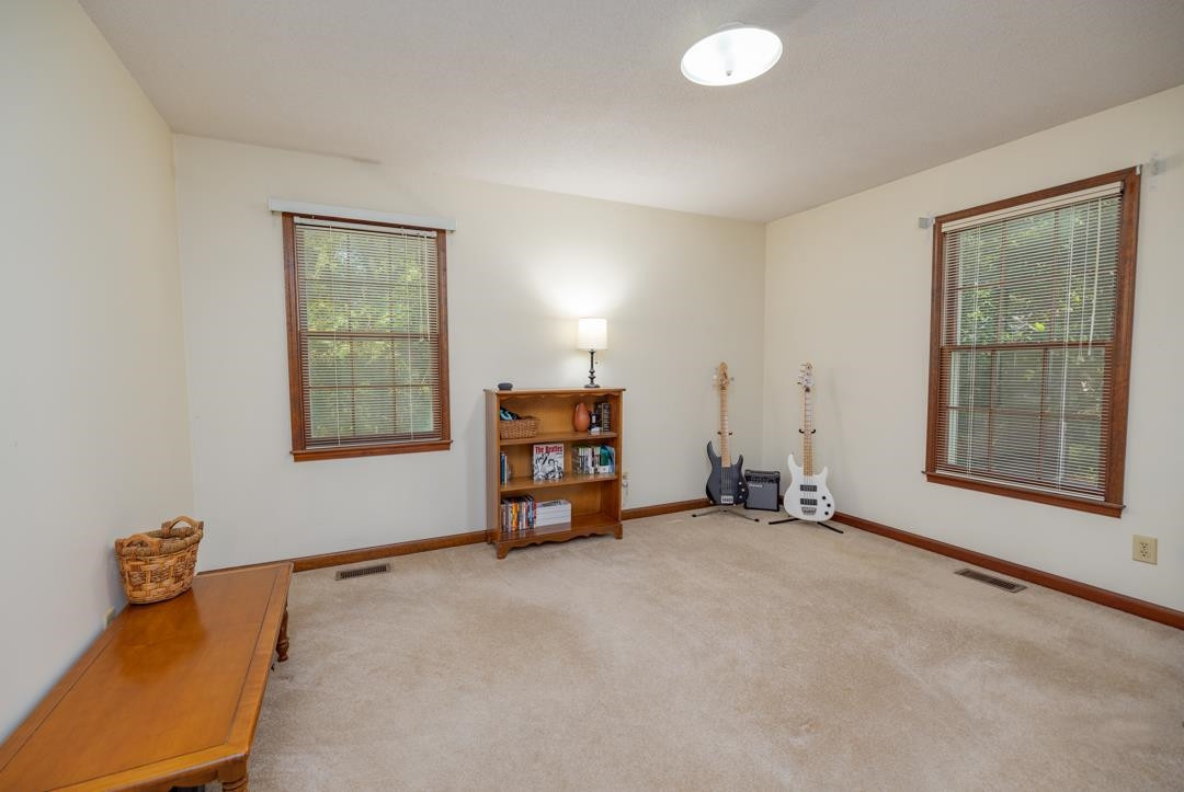 6509 Woodshire Place Raleigh, NC 27612 - Photo 25 of 30 an empty room with windows