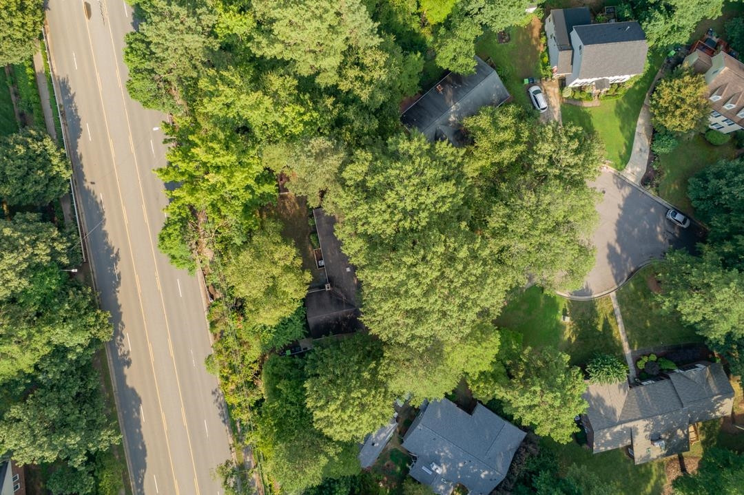 6509 Woodshire Place Raleigh, NC 27612 - Photo 29 of 30 an aerial view of residential house with outdoor space and trees all around