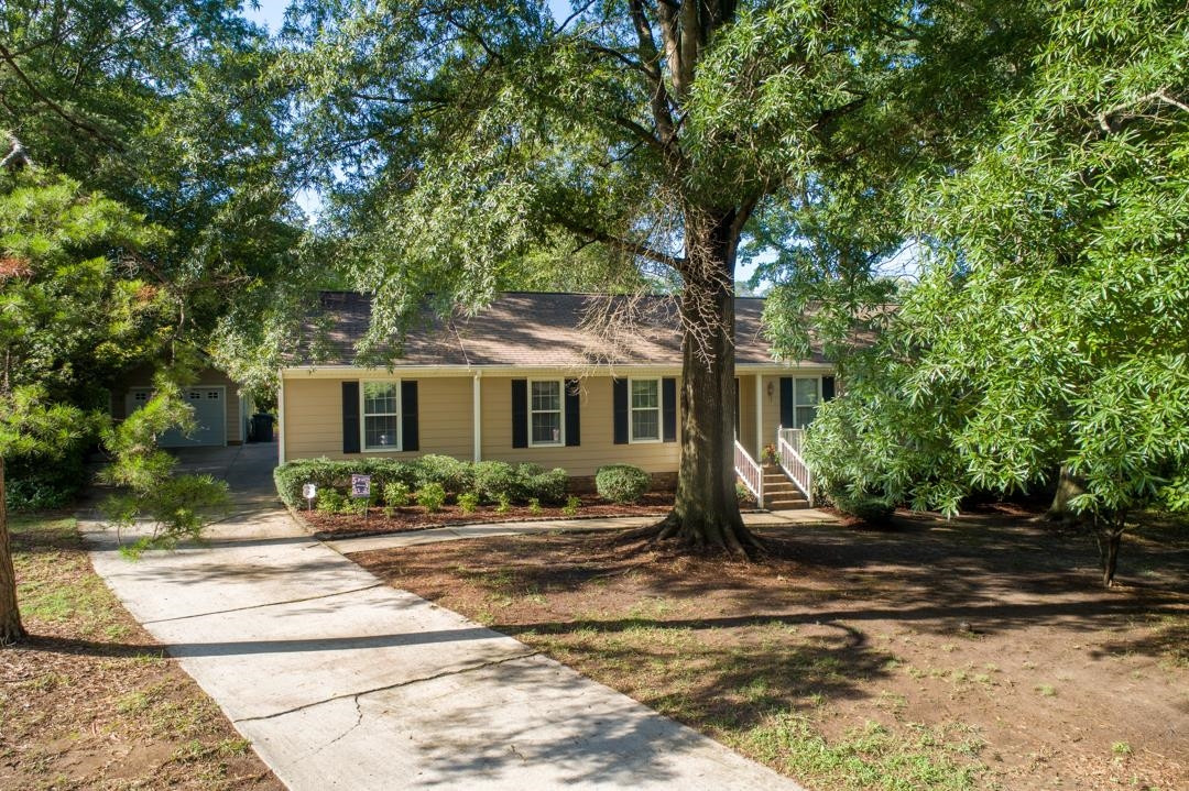 6509 Woodshire Place Raleigh, NC 27612 - Photo 30 of 30 a front view of a house with a yard