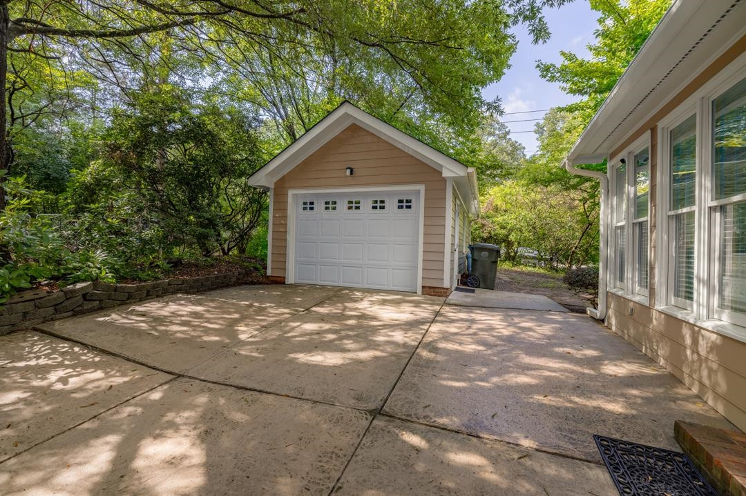 6509 Woodshire Place Raleigh, NC 27612 - Photo 4 of 30 a view of garage and yard