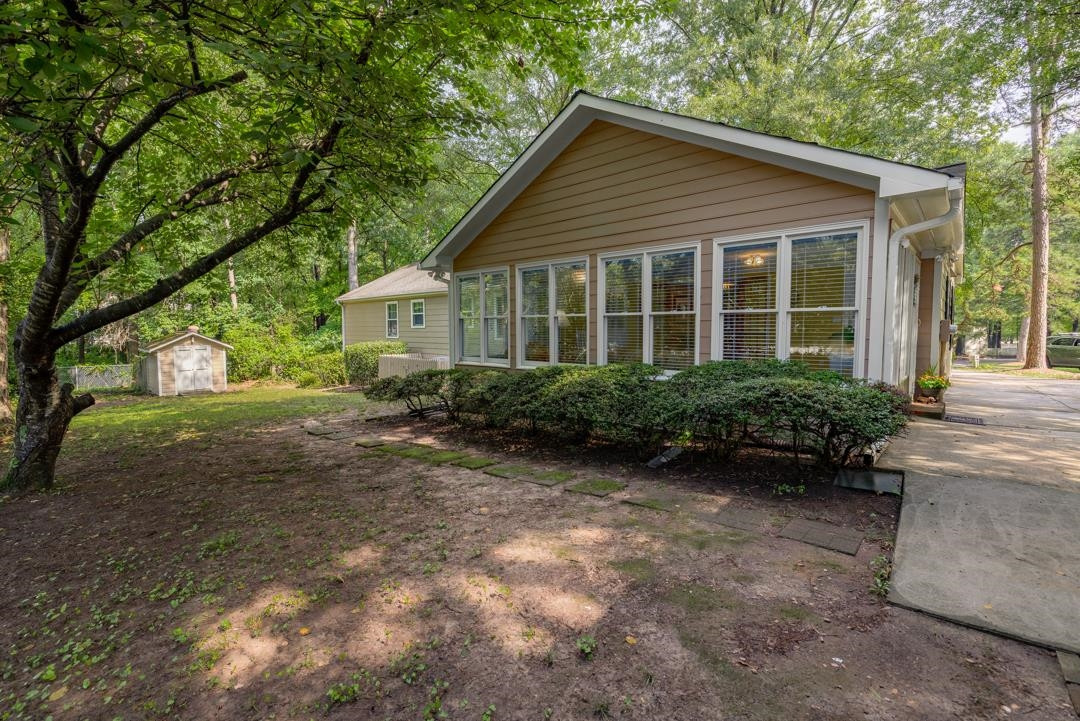 6509 Woodshire Place Raleigh, NC 27612 - Photo 6 of 30 a front view of a house with garden
