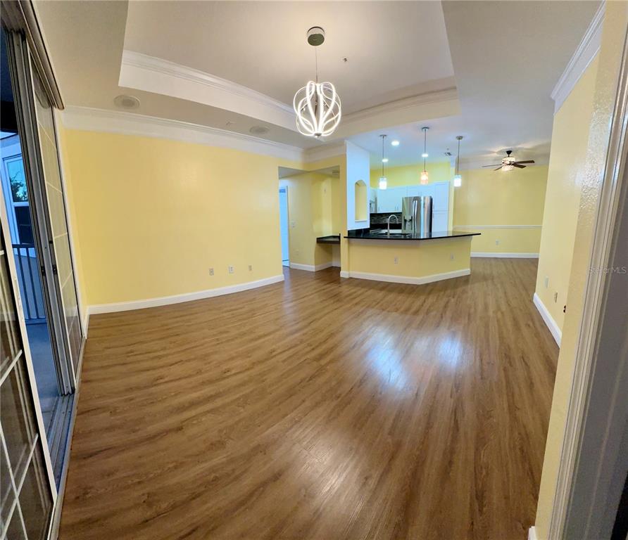 3280 Soho Street, Unit 308 Orlando, FL 32835 - Photo 16 of 45 a view of a room with wooden floor