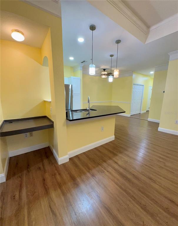 3280 Soho Street, Unit 308 Orlando, FL 32835 - Photo 21 of 45 a view of a room with wooden floor