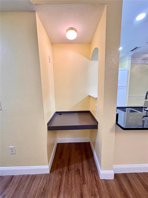 3280 Soho Street, Unit 308 Orlando, FL 32835 - Photo 22 of 45 a view of entryway with wooden floor