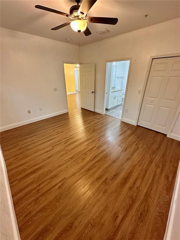 3280 Soho Street, Unit 308 Orlando, FL 32835 - Photo 23 of 45 wooden floor in an empty room with a window