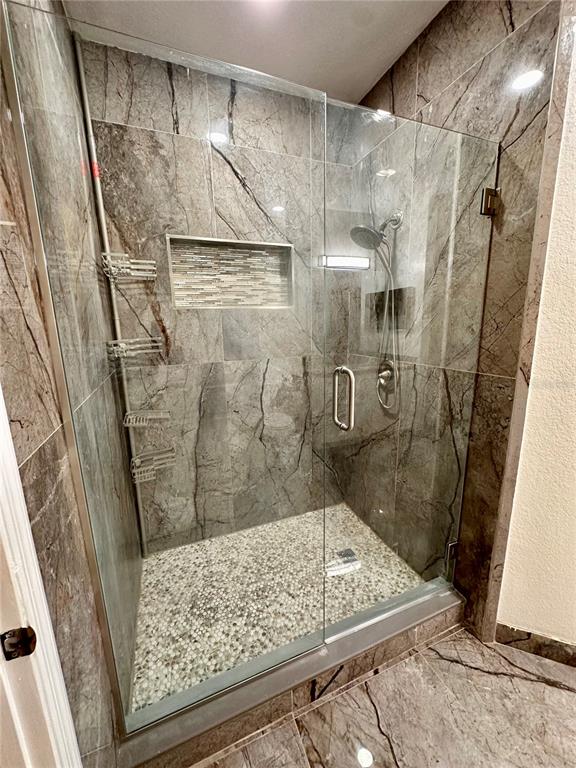 3280 Soho Street, Unit 308 Orlando, FL 32835 - Photo 25 of 45 a bathroom with a shower
