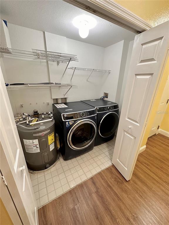 3280 Soho Street, Unit 308 Orlando, FL 32835 - Photo 33 of 45 a utility room with sink dryer and washer