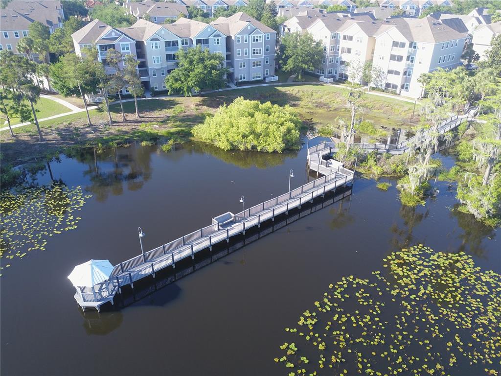 3280 Soho Street, Unit 308 Orlando, FL 32835 - Photo 36 of 45 a view of a lake with a city