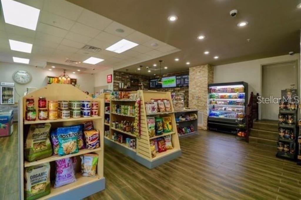 3280 Soho Street, Unit 308 Orlando, FL 32835 - Photo 42 of 45 a living room with furniture and a flat screen tv