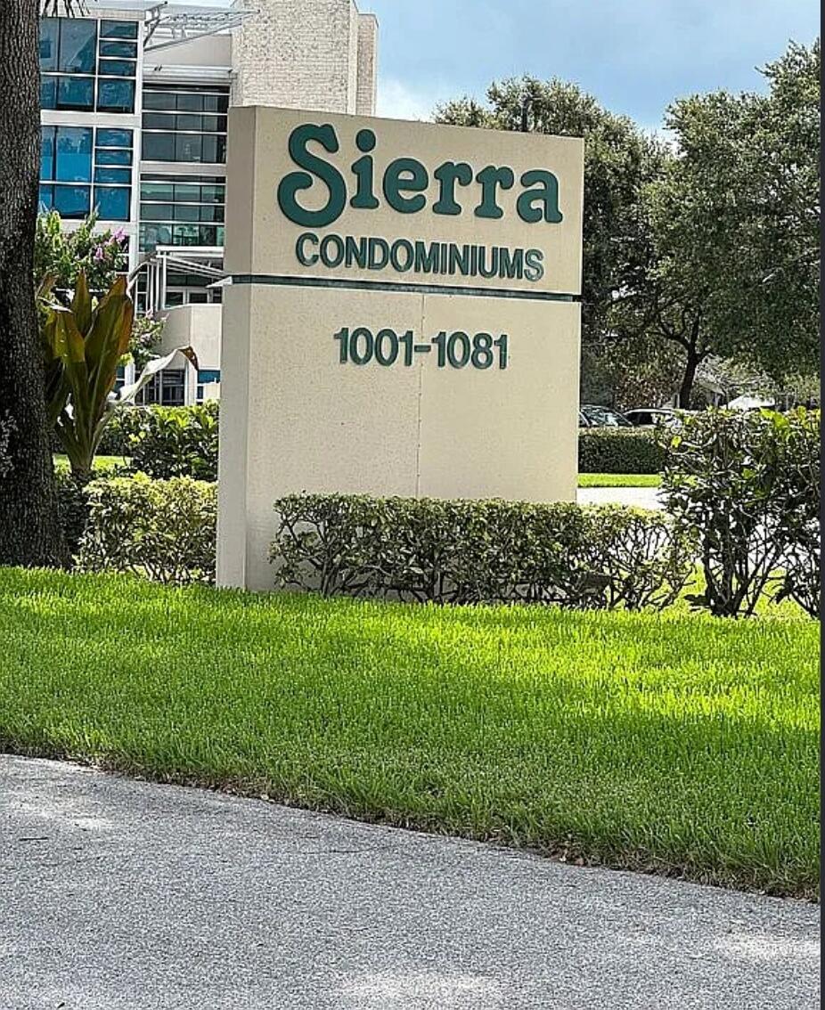 1021 Southeast Monterey Road, Unit A40 Stuart, FL 34994 - Photo 9 of 11 a sign on the side of a building