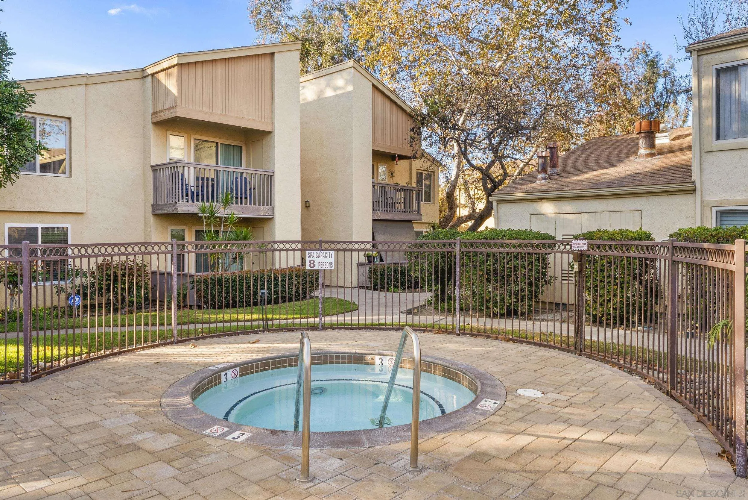 5978 Rancho Mission Road, Unit 274 San Diego, CA 92108 - Photo 14 of 23 a swimming pool with table and chairs