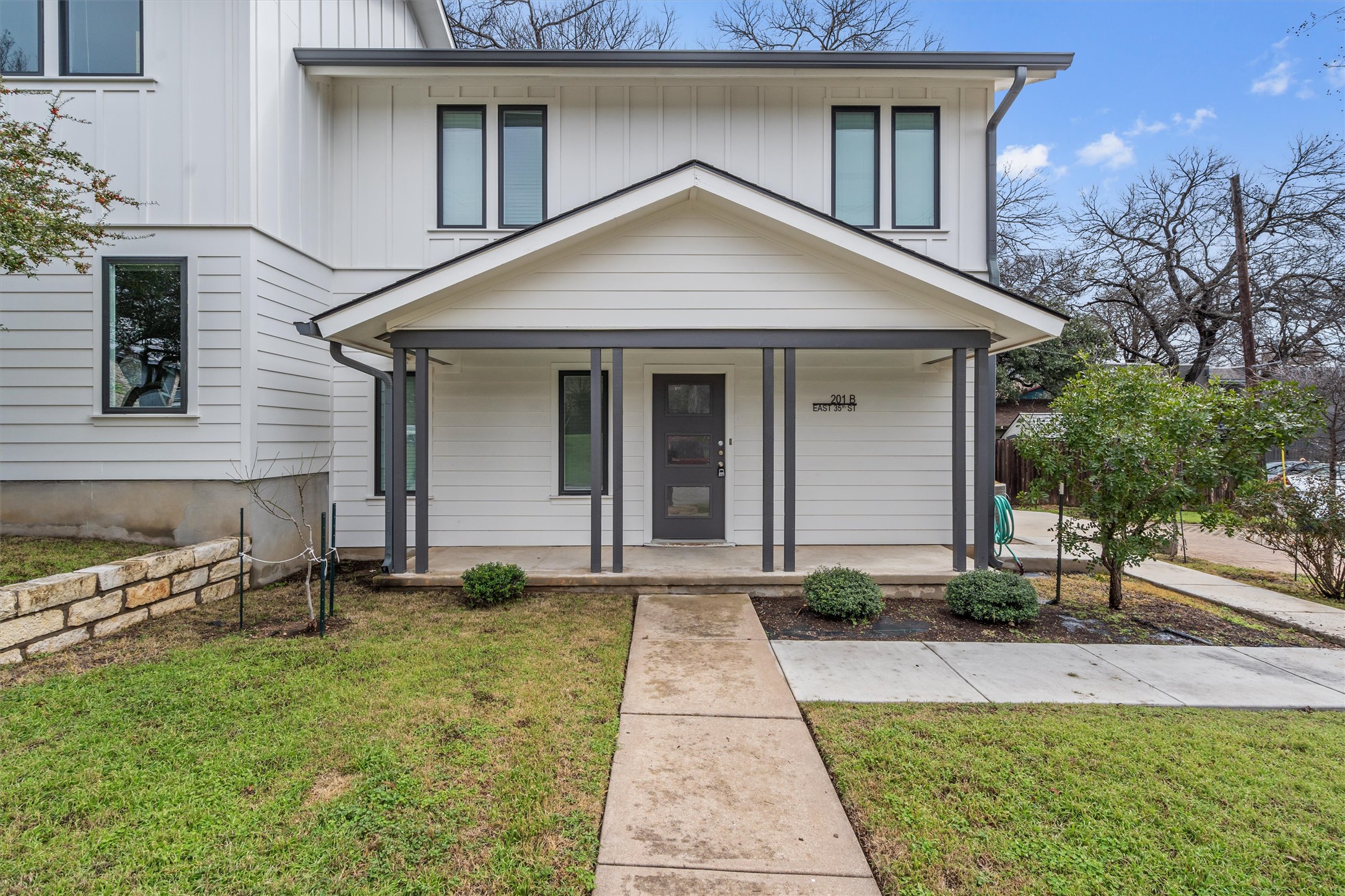 201 East 35th Street, Unit B Austin, TX 78705 - Photo 1 of 27 a front view of a house with a yard