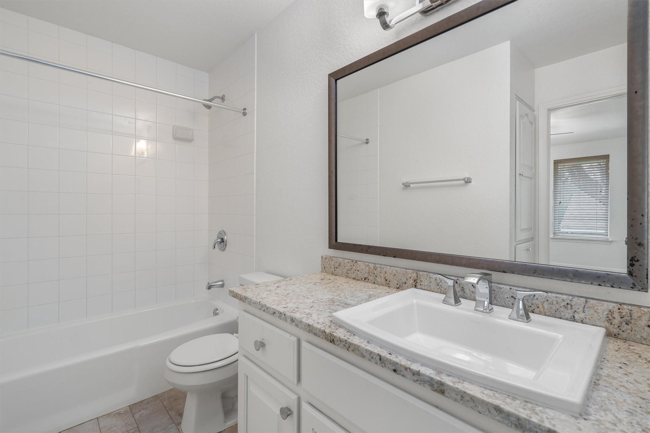 201 East 35th Street, Unit B Austin, TX 78705 - Photo 19 of 27 a bathroom with a granite countertop sink toilet and shower