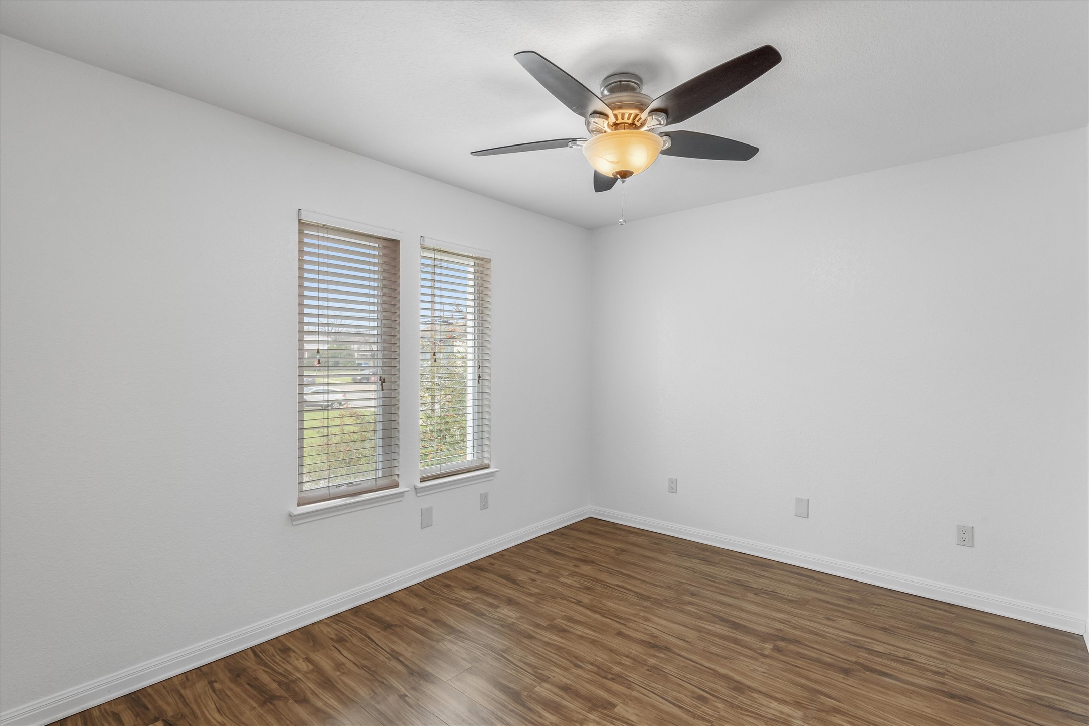 201 East 35th Street, Unit B Austin, TX 78705 - Photo 21 of 27 an empty room with wooden floor and windows