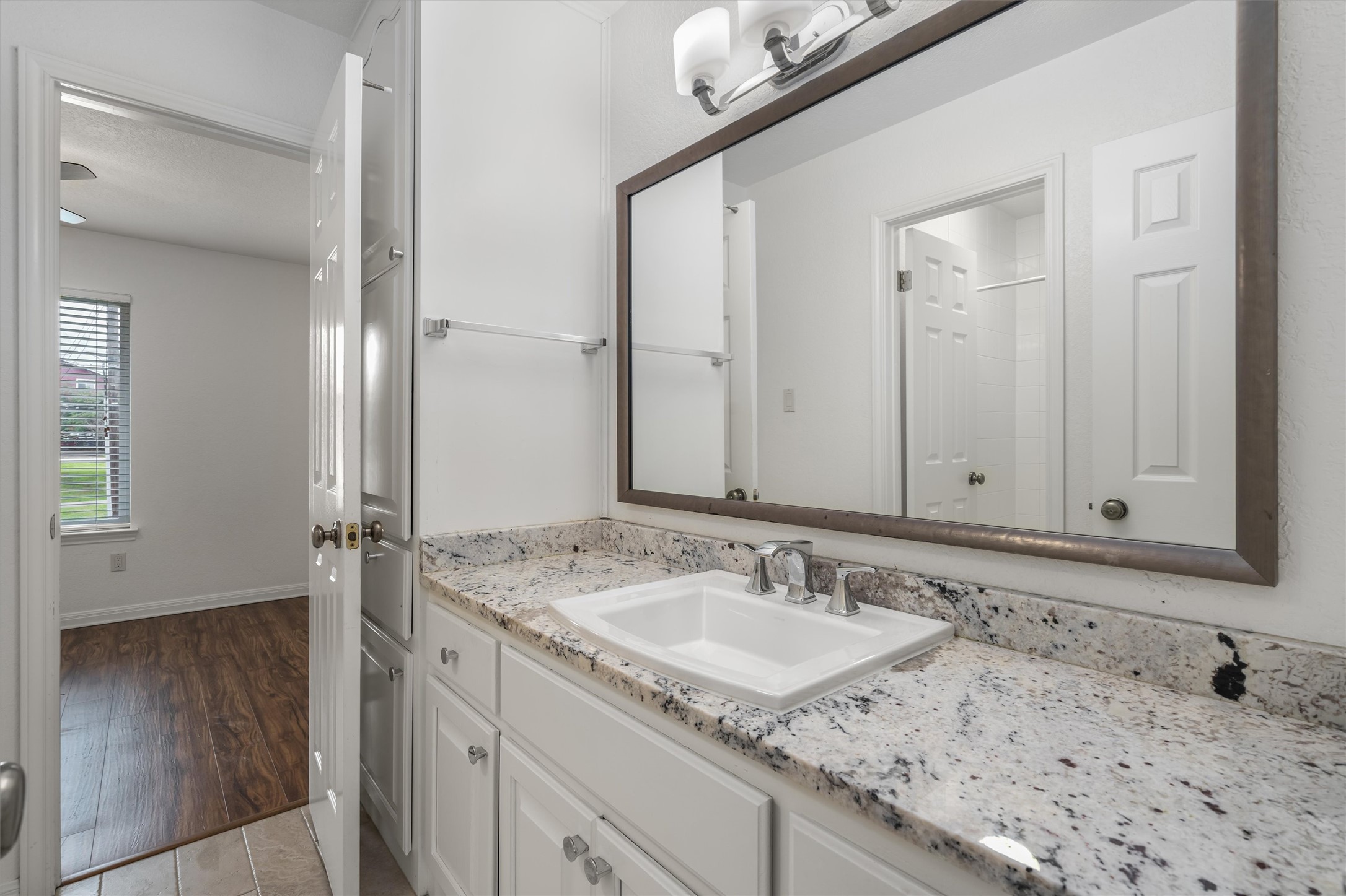 201 East 35th Street, Unit B Austin, TX 78705 - Photo 23 of 27 a bathroom with a sink and a mirror