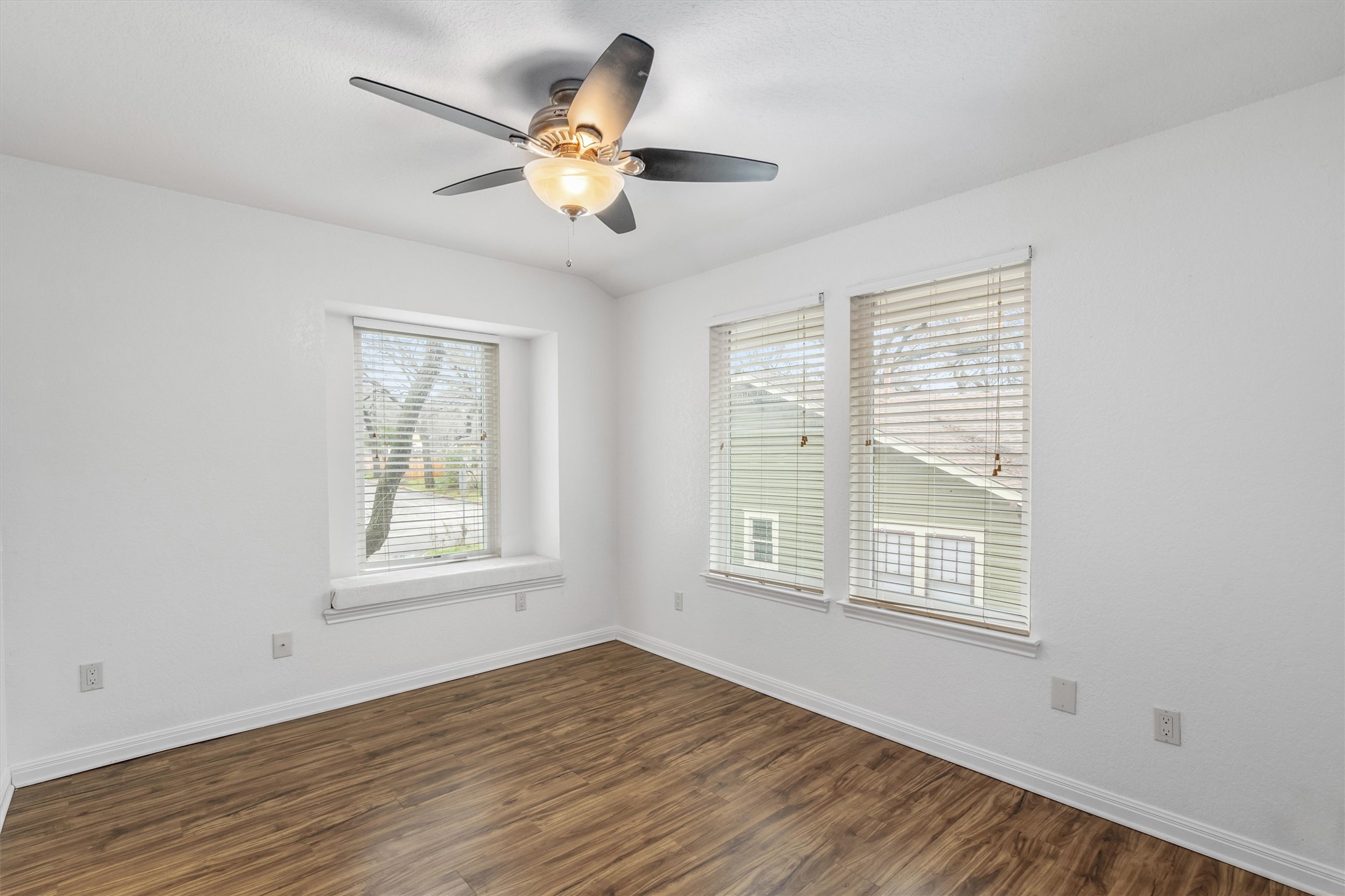 201 East 35th Street, Unit B Austin, TX 78705 - Photo 25 of 27 a view of an empty room with wooden floor and a window