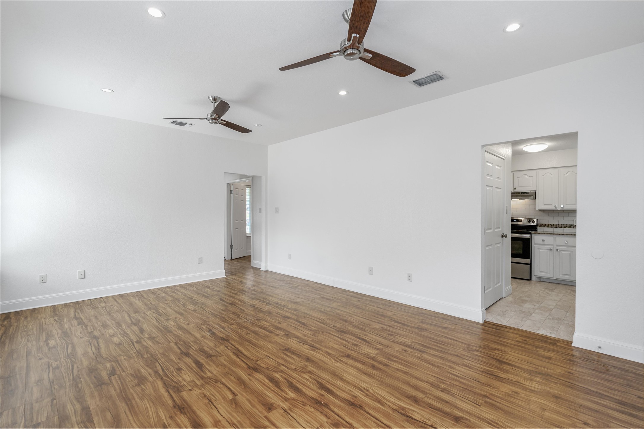 201 East 35th Street, Unit B Austin, TX 78705 - Photo 7 of 27 a view of empty room with wooden floor