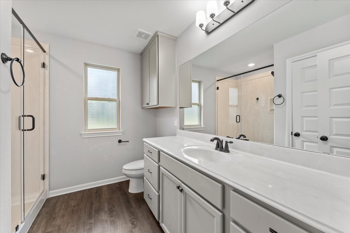 17855 Arbor Oaks Circle New Caney, TX 77357 - Photo 19 of 26 a bathroom with a sink a toilet and shower