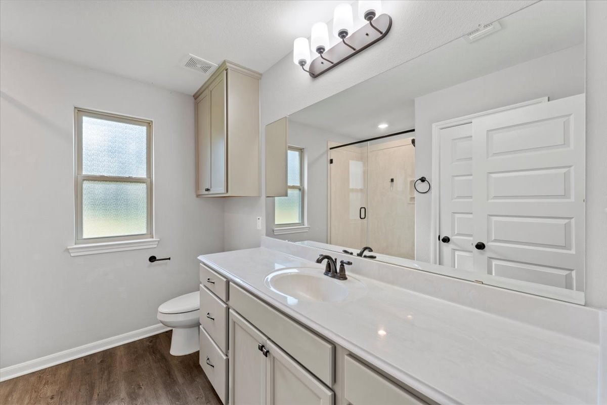 17855 Arbor Oaks Circle New Caney, TX 77357 - Photo 20 of 26 a bathroom with a sink a toilet and shower