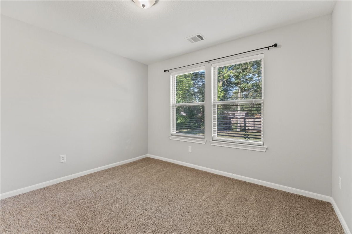 17855 Arbor Oaks Circle New Caney, TX 77357 - Photo 23 of 26 an empty room with a window
