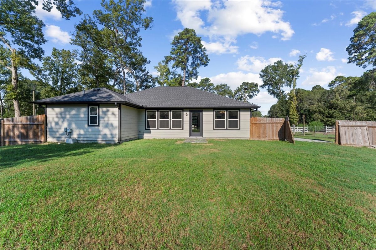17855 Arbor Oaks Circle New Caney, TX 77357 - Photo 25 of 26 a front view of a house with a garden