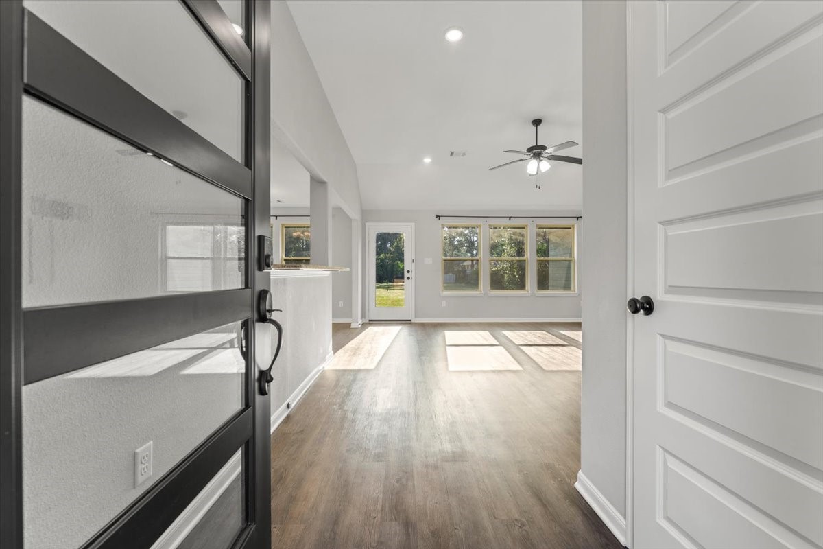 17855 Arbor Oaks Circle New Caney, TX 77357 - Photo 7 of 26 a view of an entryway with wooden floor and a window