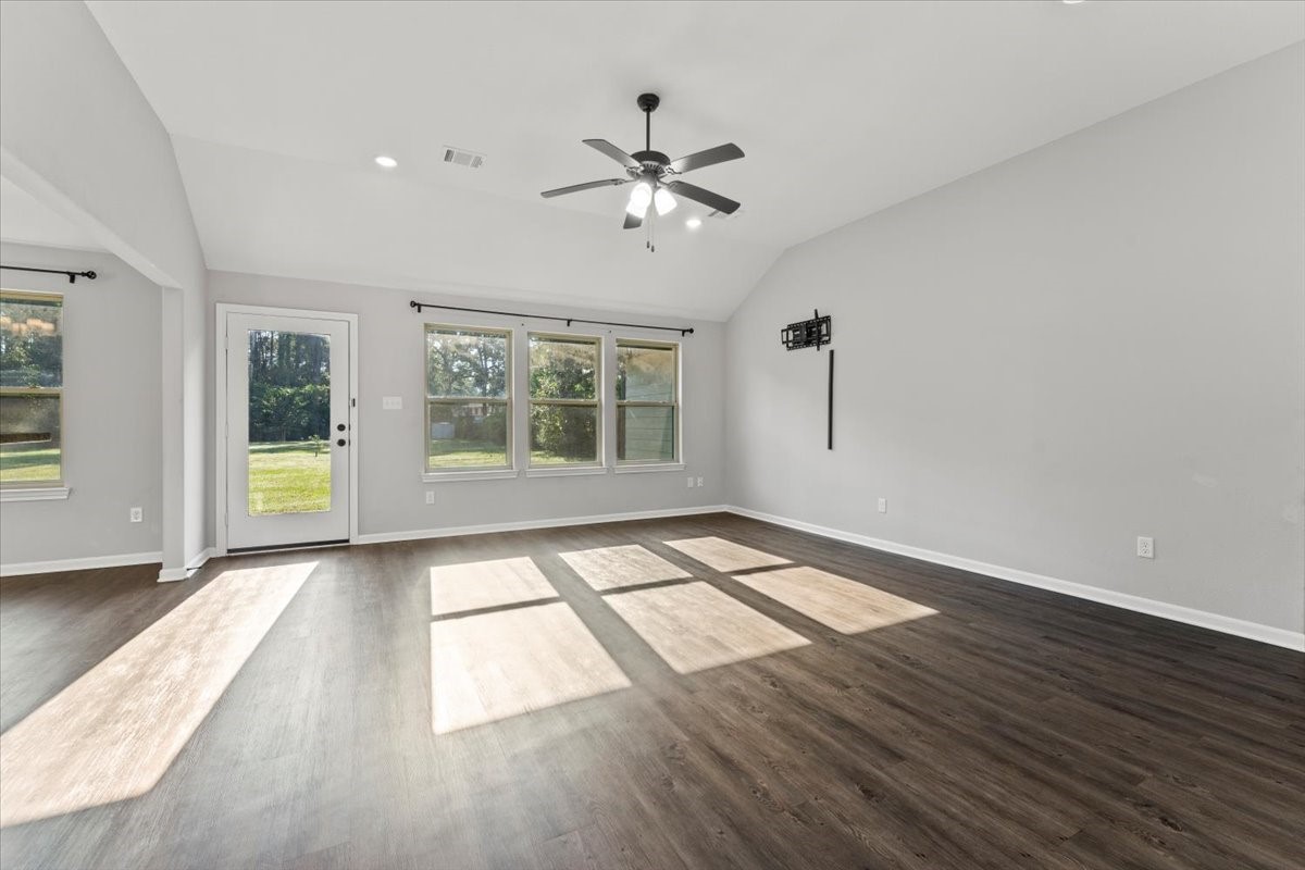 17855 Arbor Oaks Circle New Caney, TX 77357 - Photo 10 of 26 a view of an empty room with a window and wooden floor