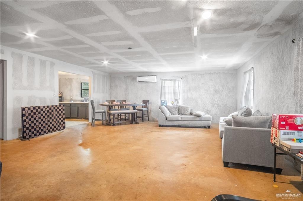 3905 Los Ebanos Road Mission, TX 78573 - Photo 5 of 20 a living room with furniture rug and a table