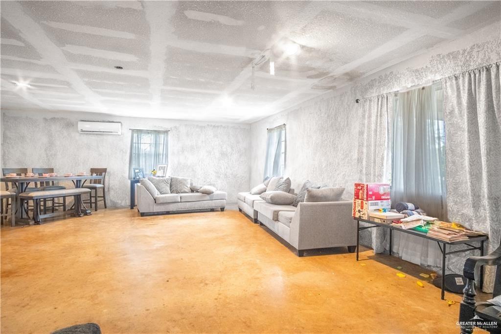 3905 Los Ebanos Road Mission, TX 78573 - Photo 6 of 20 a living room with furniture and a table