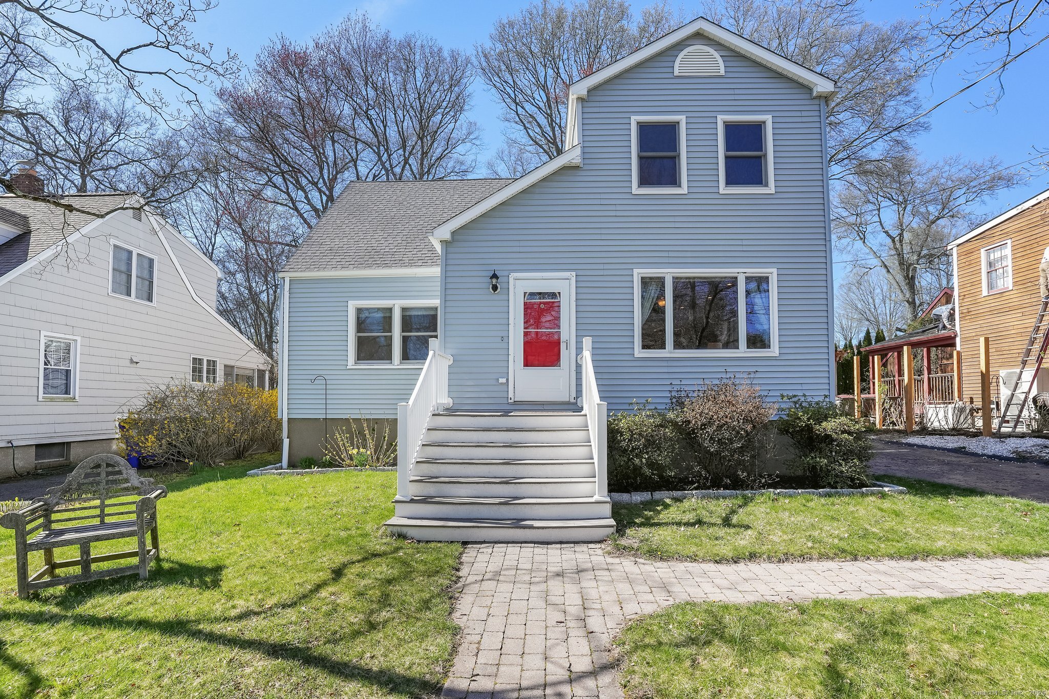 a front view of a house with a yard