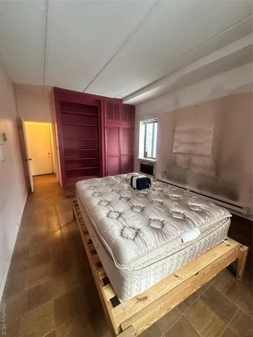 a view of room with air conditioner and windows