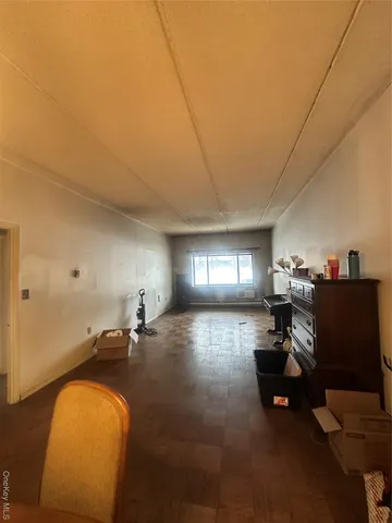 a living room with furniture and a gym equipment